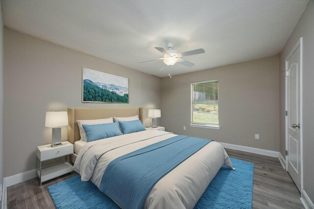 bedroom featuring hardwood / wood-style floors and ceiling fan