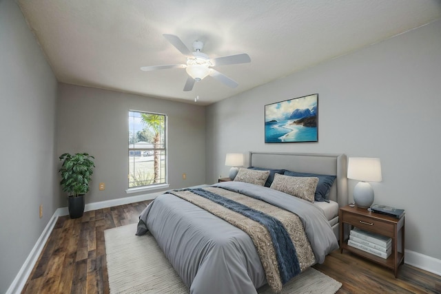 bedroom featuring dark hardwood / wood-style floors and ceiling fan