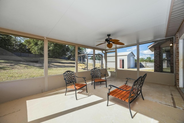 sunroom / solarium featuring ceiling fan and a wealth of natural light