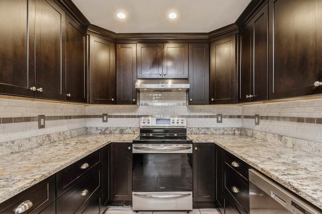 kitchen with tasteful backsplash, dark brown cabinetry, light stone countertops, and stainless steel appliances