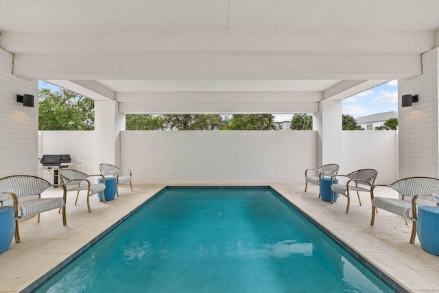 view of pool featuring a patio