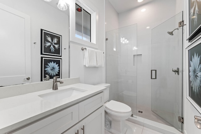 bathroom with vanity, an enclosed shower, toilet, and tile patterned flooring