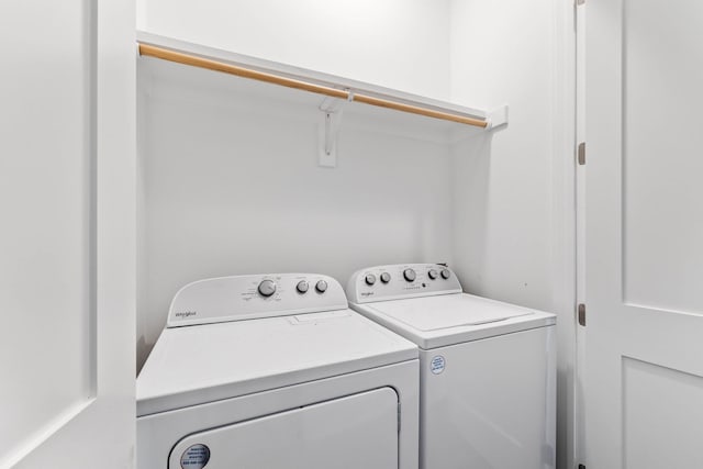 washroom featuring washer and clothes dryer