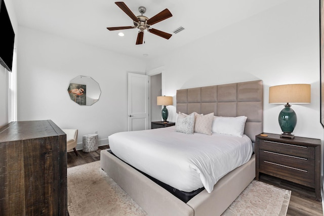 bedroom with hardwood / wood-style flooring and ceiling fan