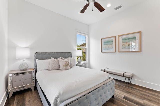 bedroom with ceiling fan and dark hardwood / wood-style flooring