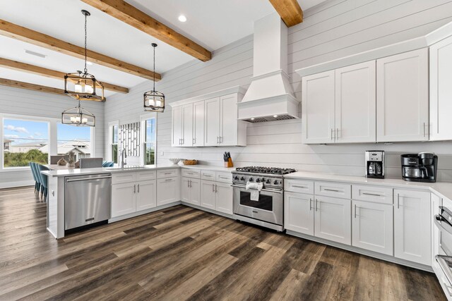 32 Cote Dazur Dr, Santa Rosa Beach, FL 32459 - kitchen with appliances with stainless steel finishes, a peninsula, dark wood-style floors, custom exhaust hood, and white cabinetry