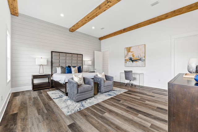 bedroom featuring wooden walls, beamed ceiling, and dark hardwood / wood-style floors