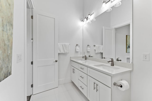 bathroom featuring tile patterned flooring and vanity