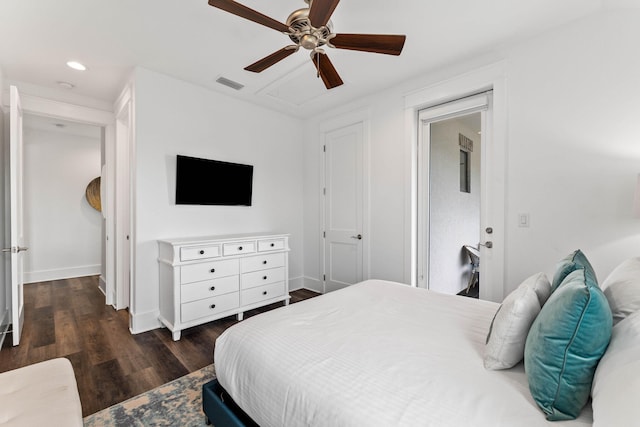 bedroom with dark hardwood / wood-style floors and ceiling fan