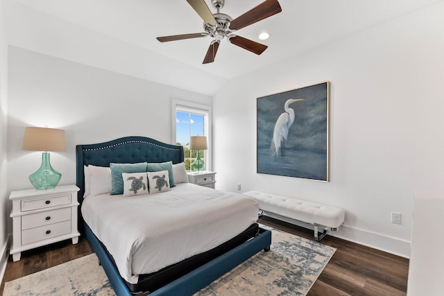 bedroom with vaulted ceiling, ceiling fan, and dark hardwood / wood-style floors