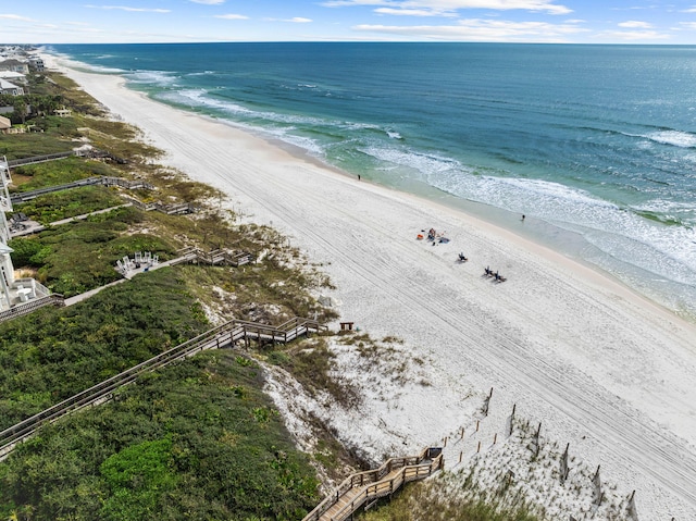 birds eye view of property featuring a view of the beach and a water view