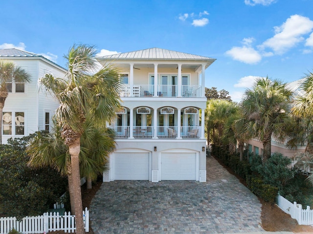 coastal home with a balcony and a garage