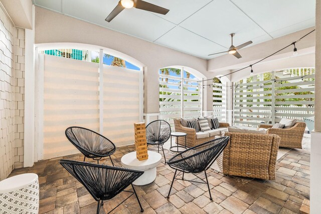 sunroom / solarium with ceiling fan