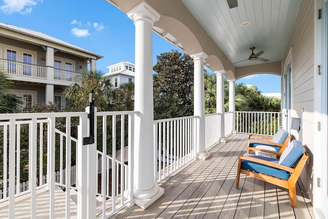 balcony with a porch and ceiling fan