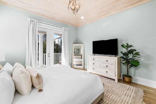 bedroom with access to exterior, french doors, wood ceiling, vaulted ceiling, and light hardwood / wood-style flooring