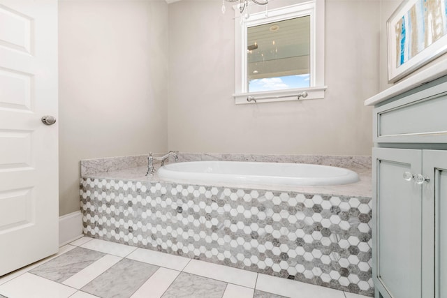 bathroom with tiled bath and tile patterned floors