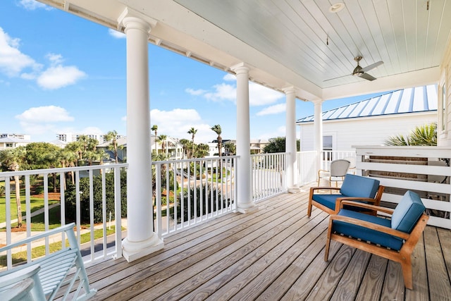 wooden deck featuring ceiling fan