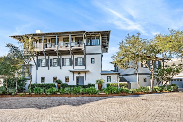 view of front of property with a balcony