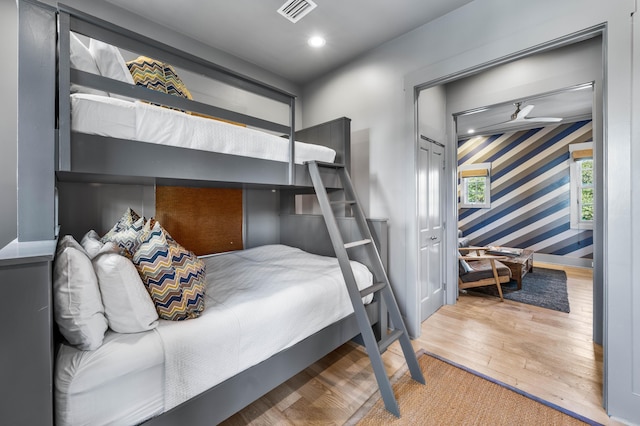 bedroom featuring hardwood / wood-style floors and a closet