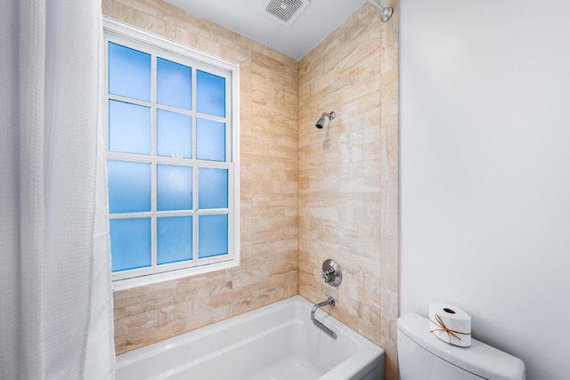 bathroom with shower / tub combo, toilet, and plenty of natural light