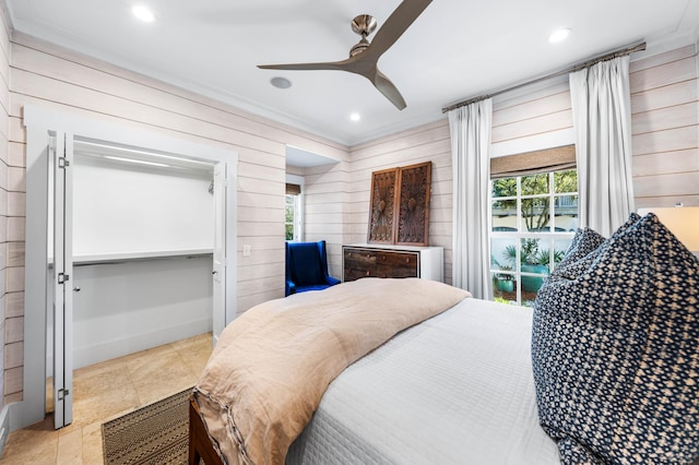 bedroom featuring ceiling fan and ornamental molding