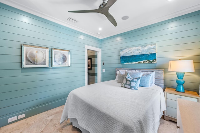 bedroom with crown molding, ceiling fan, and wooden walls