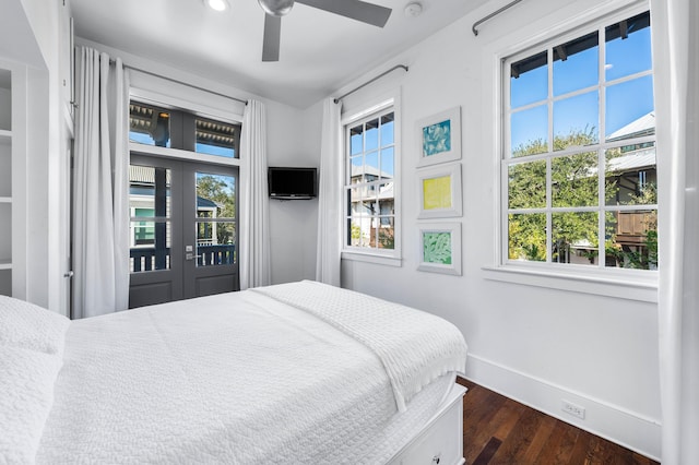 bedroom featuring access to exterior, french doors, ceiling fan, and dark wood-type flooring