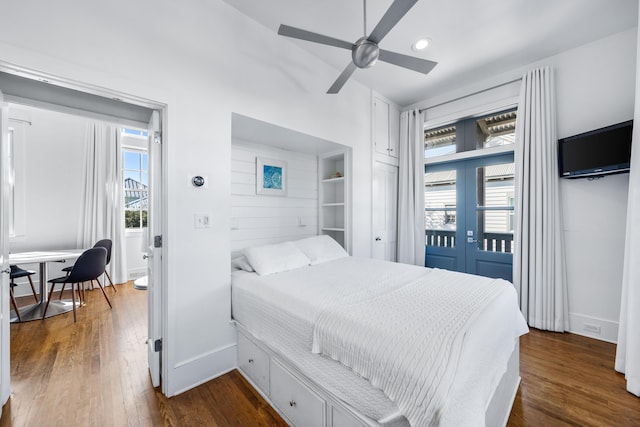 bedroom featuring ceiling fan, dark wood-type flooring, access to outside, and french doors