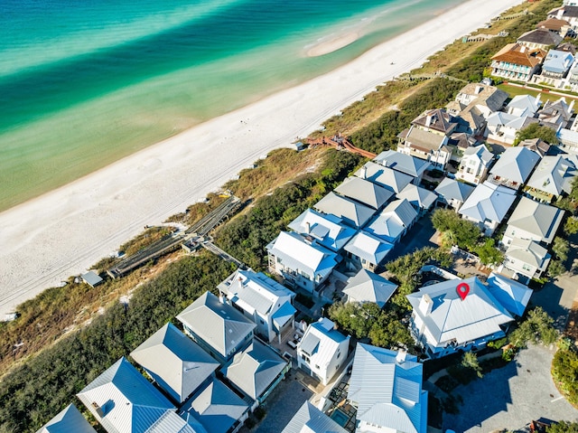 aerial view featuring a view of the beach and a water view