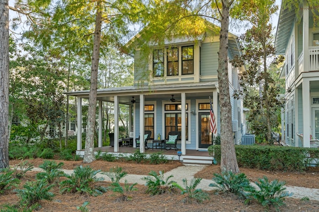 view of front of property with a porch, central AC unit, and ceiling fan