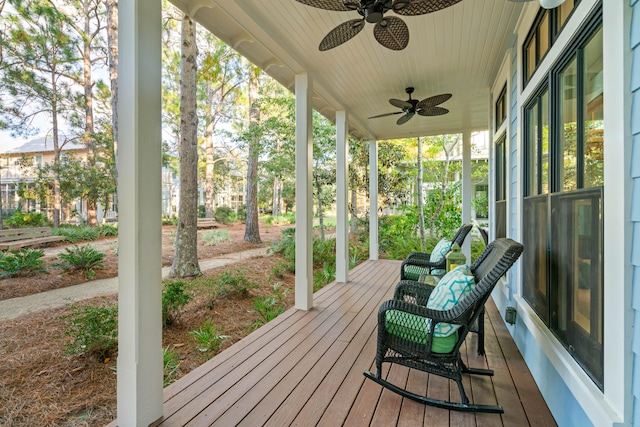 wooden deck with ceiling fan and a porch