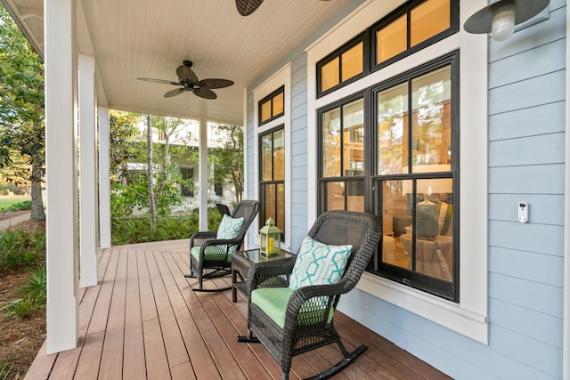 wooden deck with ceiling fan and covered porch