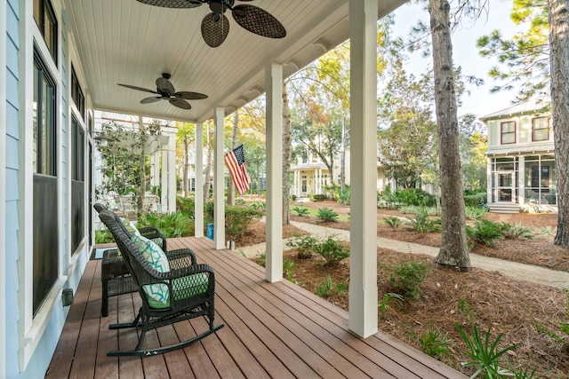 wooden deck featuring ceiling fan