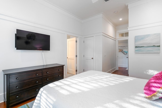 bedroom featuring dark hardwood / wood-style floors and ornamental molding