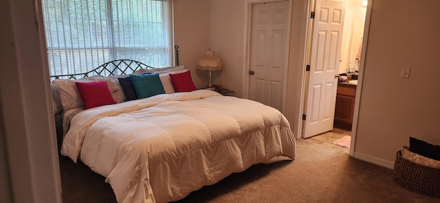 bedroom featuring light colored carpet