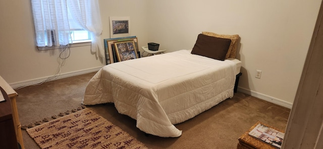 bedroom featuring dark carpet