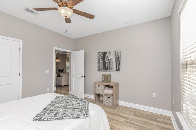 bedroom featuring light hardwood / wood-style floors and ceiling fan