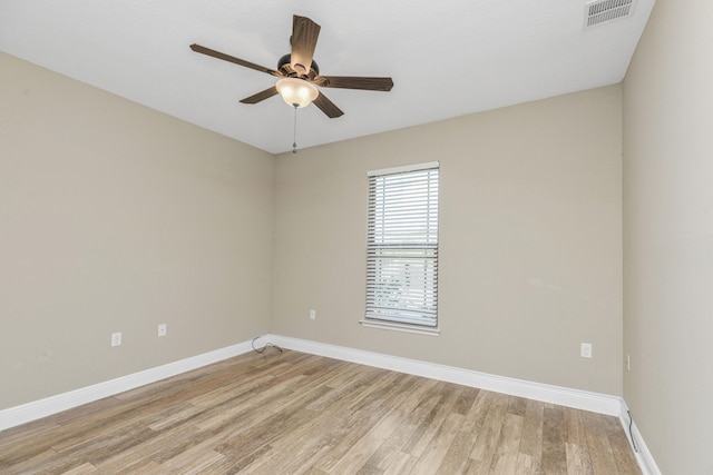 empty room with light hardwood / wood-style floors and ceiling fan