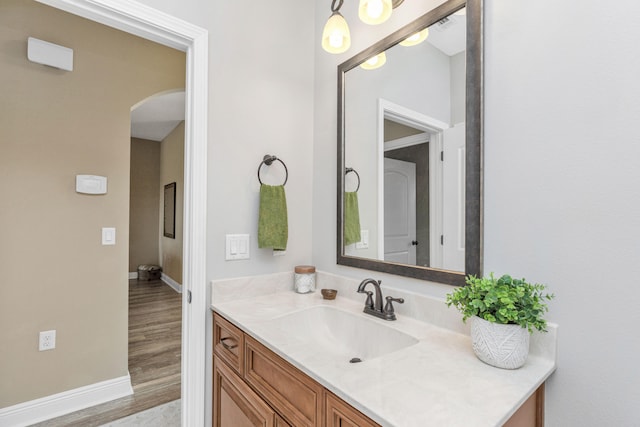 bathroom featuring hardwood / wood-style flooring and vanity