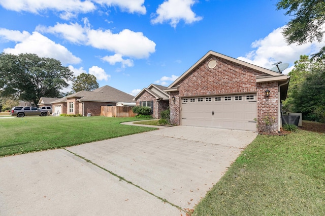 view of front of property with a garage and a front lawn