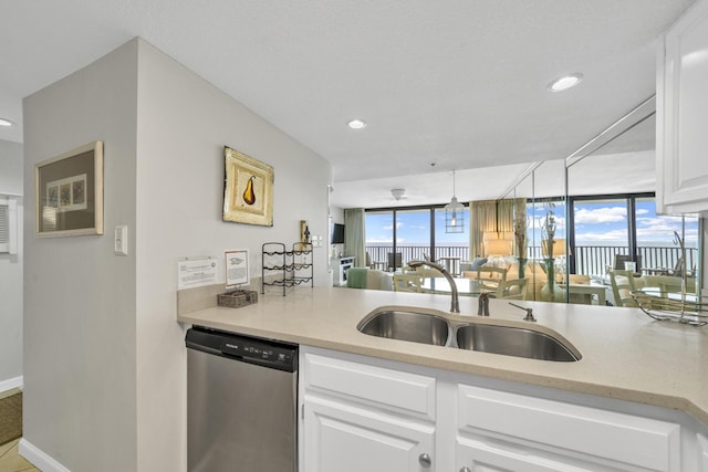 4100 E Co Hwy Unit 30A 1102 # 1102, Santa Rosa Beach, FL 32459 - kitchen featuring stainless steel dishwasher, a sink, white cabinetry, recessed lighting, and baseboards