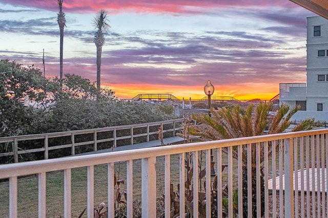 view of balcony at dusk