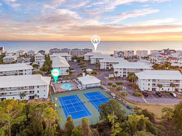 aerial view at dusk with a water view