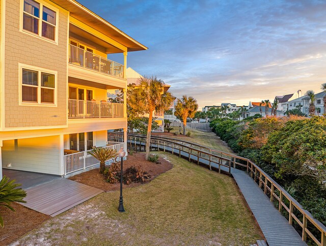 yard at dusk with a balcony