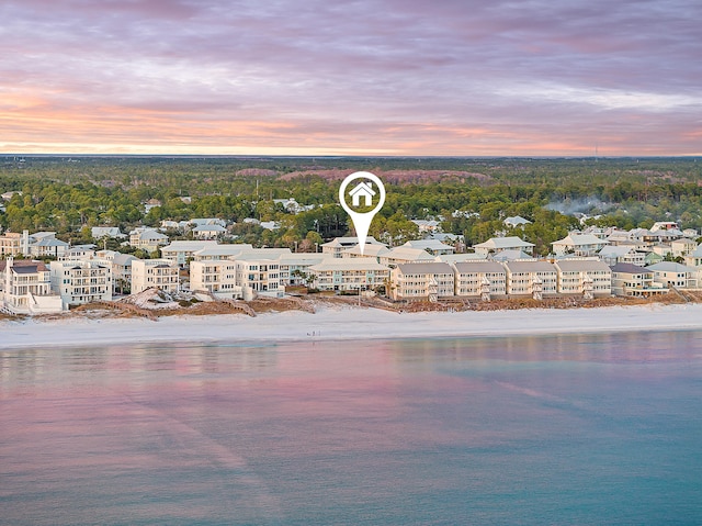 aerial view at dusk with a water view