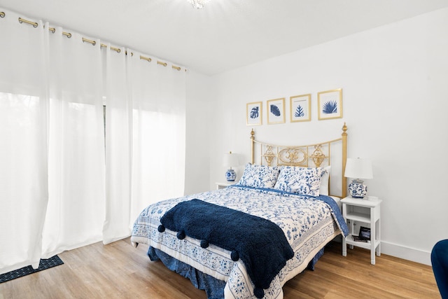 bedroom with wood-type flooring