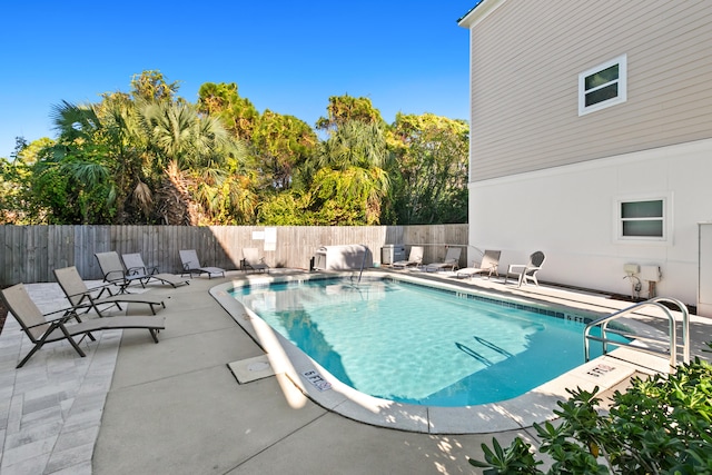 view of pool featuring a patio