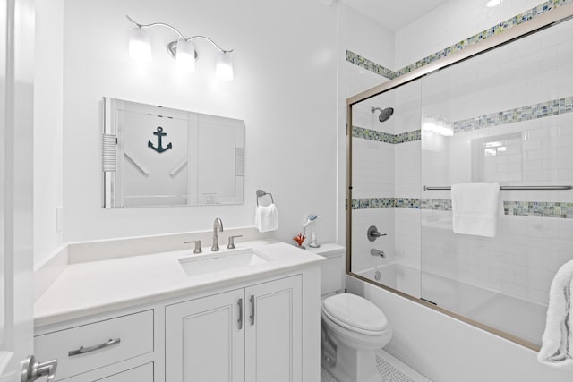 full bathroom featuring toilet, vanity, bath / shower combo with glass door, and tile patterned flooring