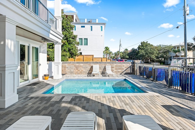 view of swimming pool with a patio area