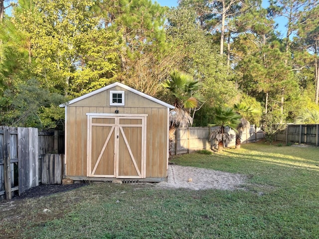 view of outdoor structure with a lawn